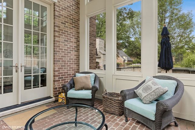 a bath tub sitting in a bathroom next to a window
