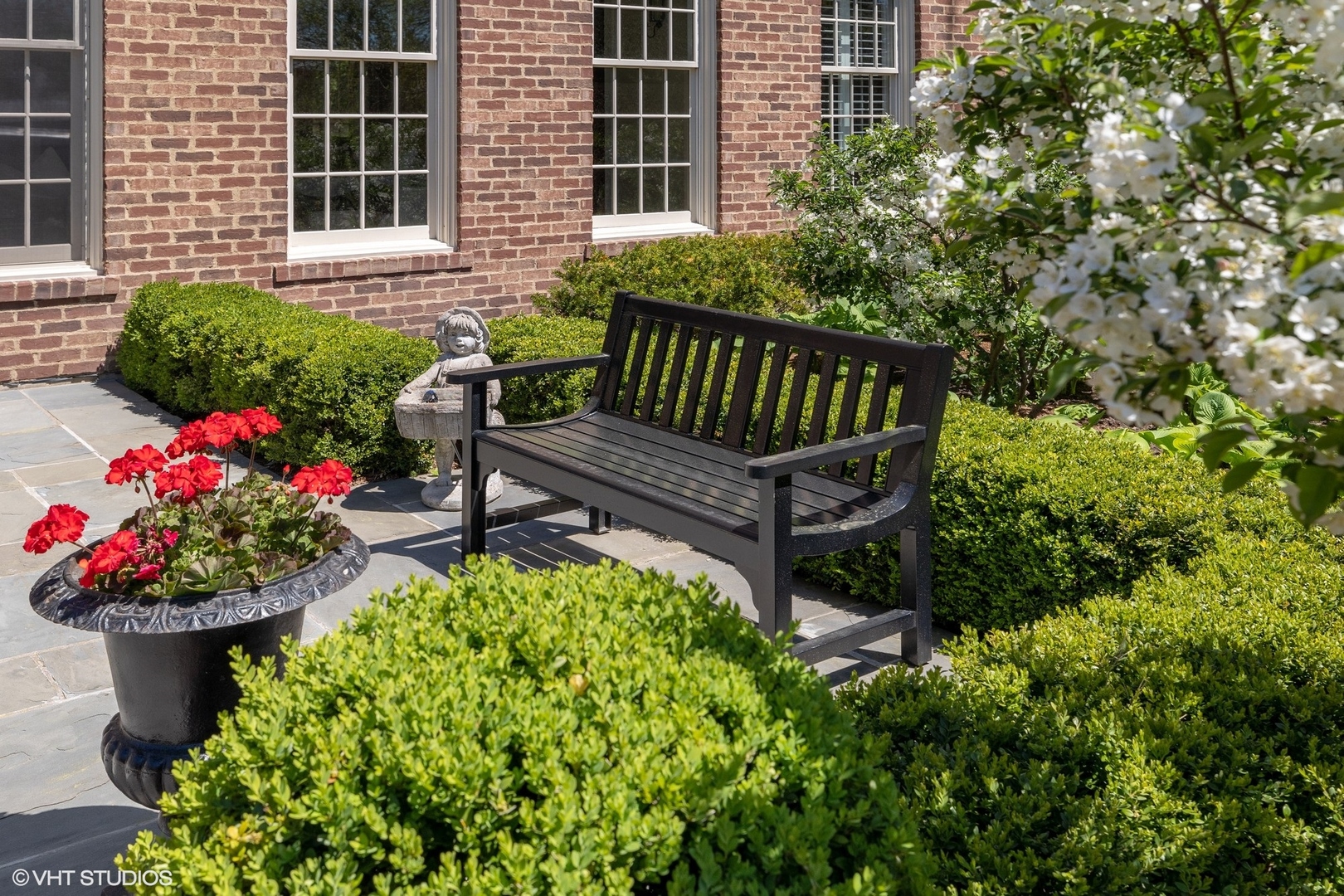 725 Walden Road Winnetka, IL 60093 - Photo 24 of 84 a view of a wooden bench in the backyard of a house