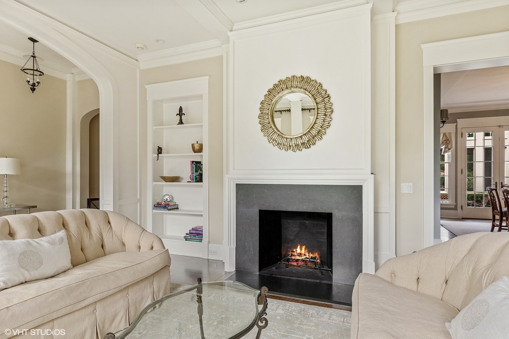 725 Walden Road Winnetka, IL 60093 - Photo 26 of 84 a living room with furniture a mirror and a fireplace
