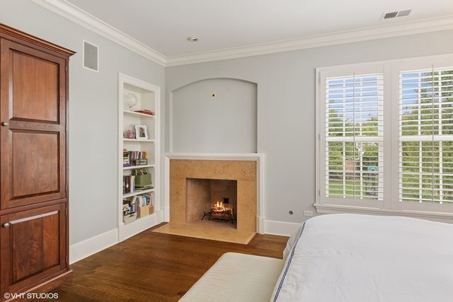 a bedroom with a bed and a table