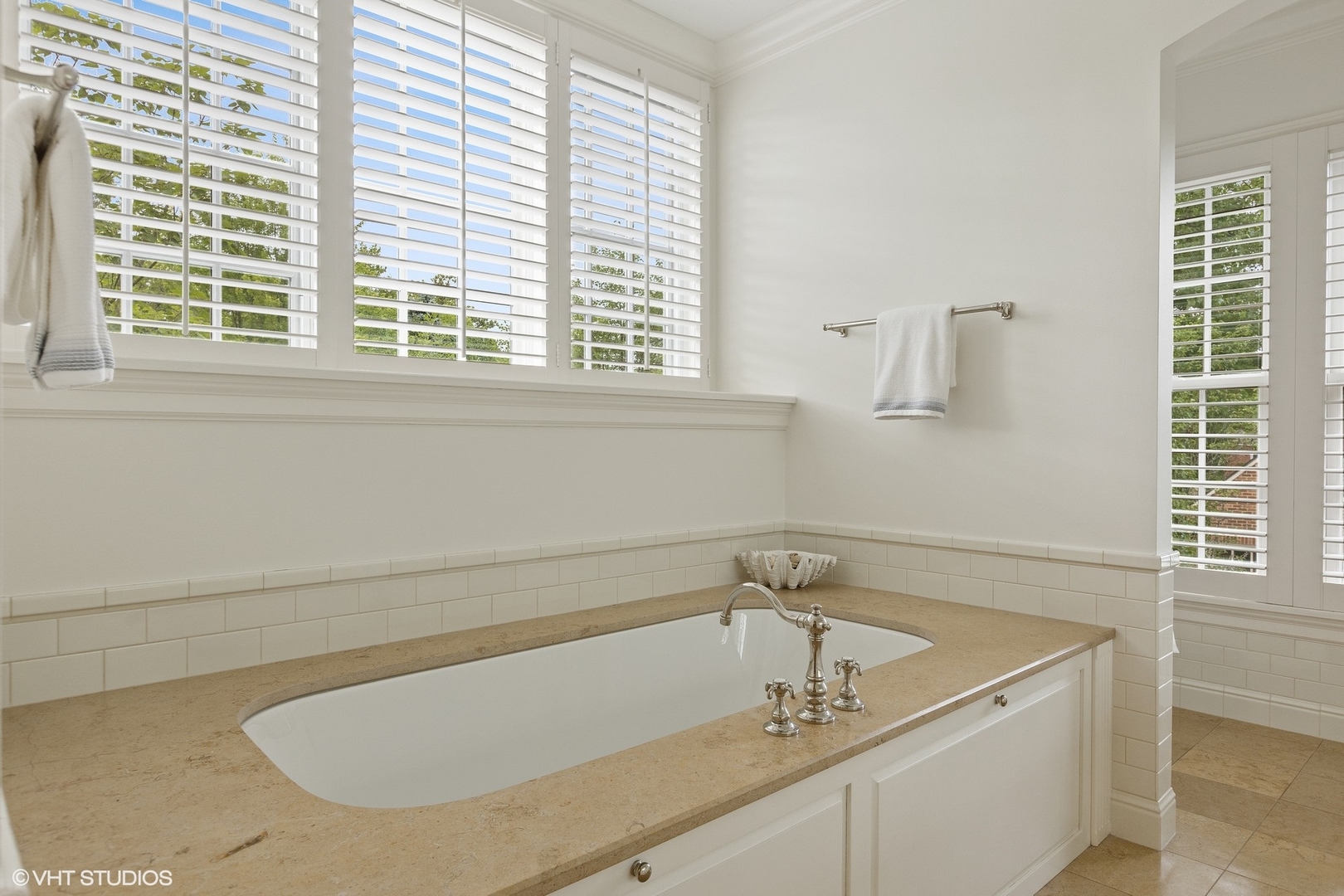725 Walden Road Winnetka, IL 60093 - Photo 35 of 84 a bath tub sitting in a bathroom next to a window