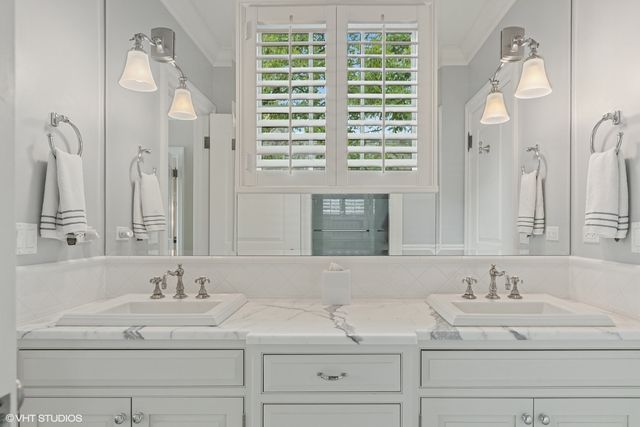 a view of a house with pool porch and chairs