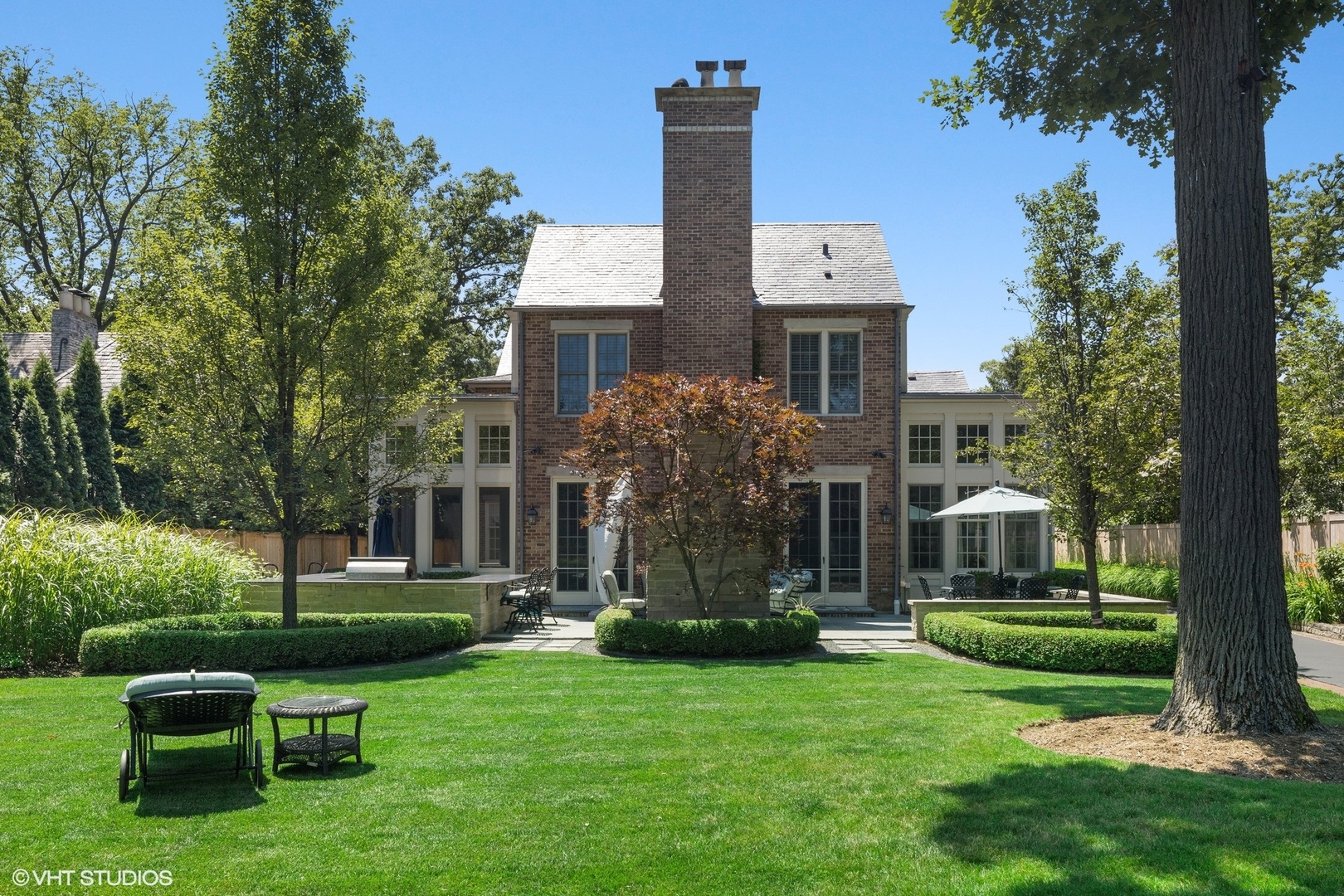 725 Walden Road Winnetka, IL 60093 - Photo 53 of 84 a front view of a house with garden