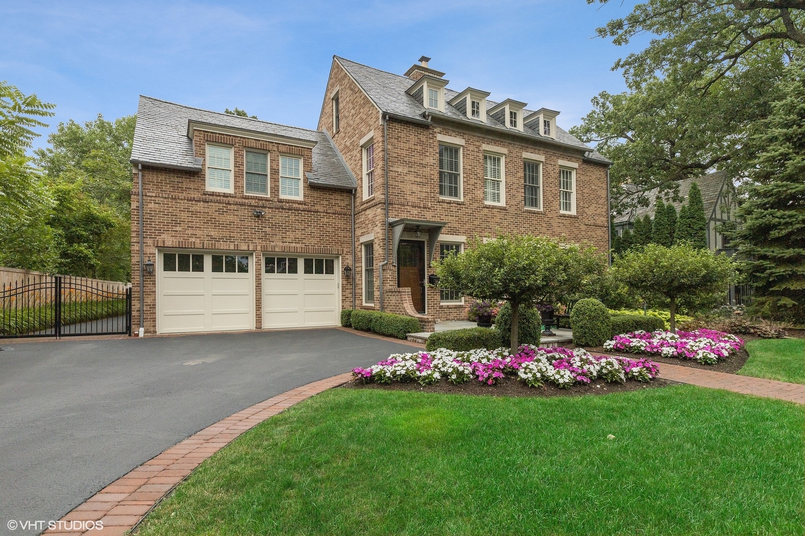 725 Walden Road Winnetka, IL 60093 - Photo 57 of 84 a front view of a house with a yard and garage