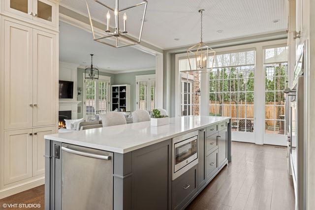 a dining room with furniture window and wooden floor