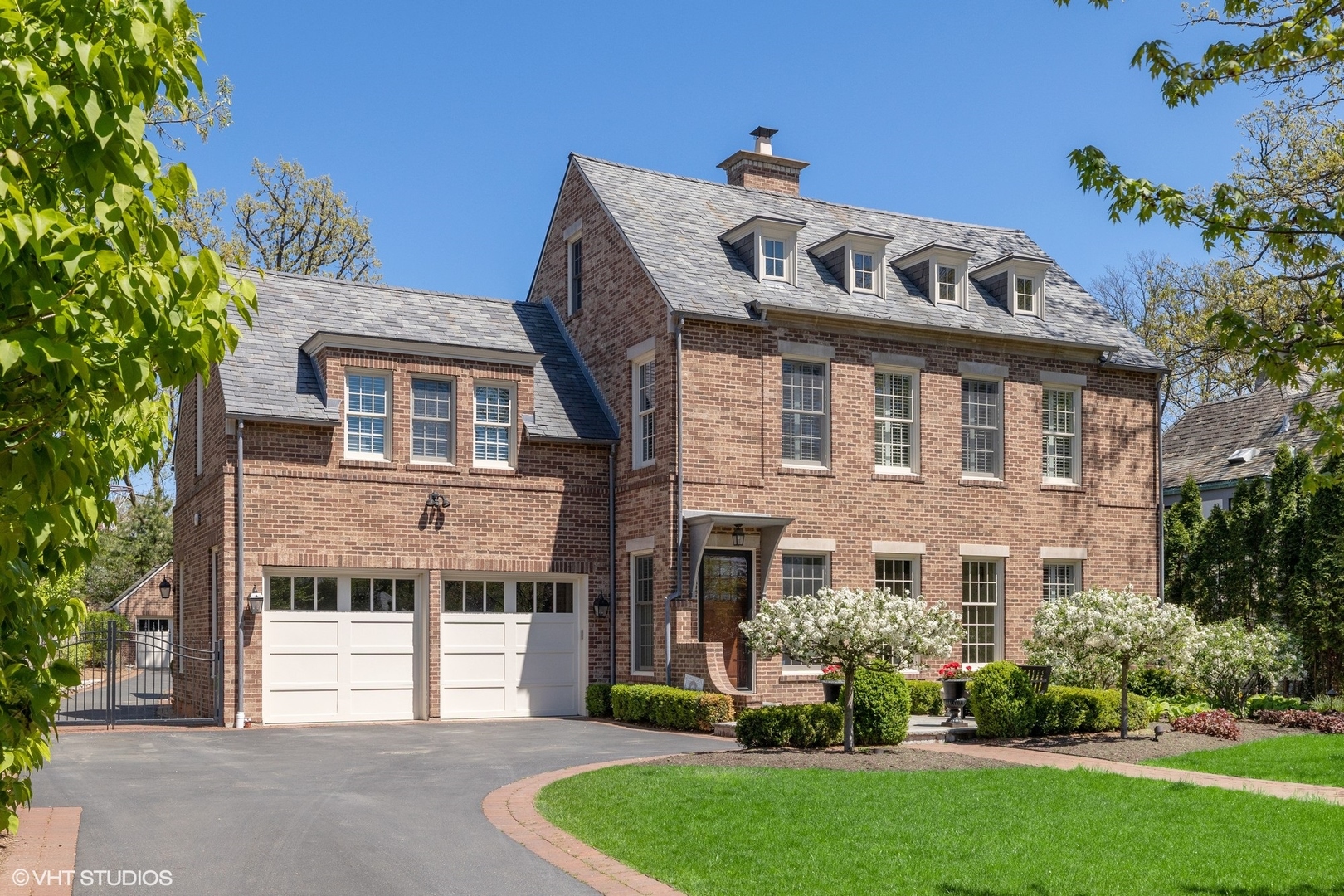 725 Walden Road Winnetka, IL 60093 - Photo 61 of 84 a front view of a house with a garden