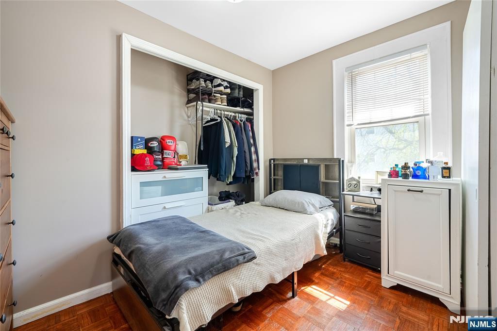 728 Devon Street Kearny, NJ 07032 - Photo 15 of 26 a bedroom with a bed and a closet