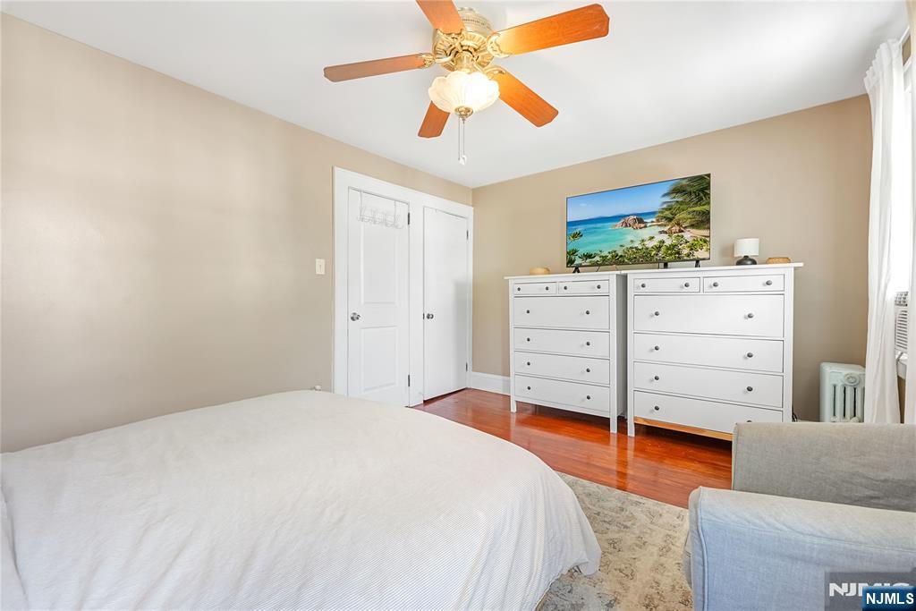 728 Devon Street Kearny, NJ 07032 - Photo 18 of 26 a bedroom with a bed and a dresser