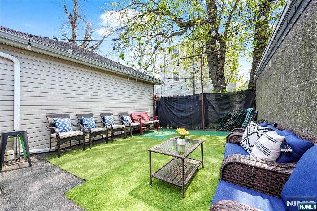 728 Devon Street Kearny, NJ 07032 - Photo 24 of 26 a backyard of a house with seating space