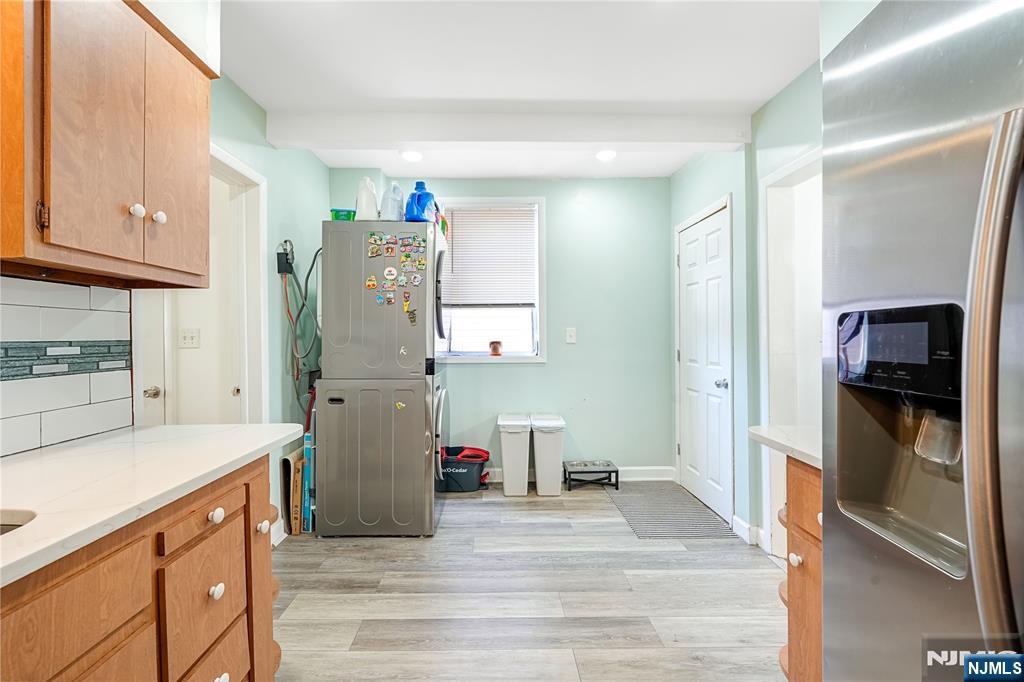 728 Devon Street Kearny, NJ 07032 - Photo 10 of 26 a kitchen with a refrigerator and a sink