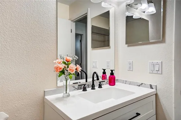 a view of a livingroom with furniture and a flat screen tv