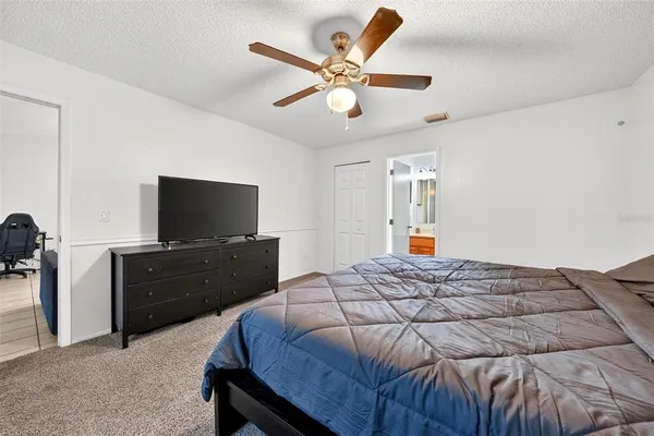 a bathroom with a glass shower door and a shower