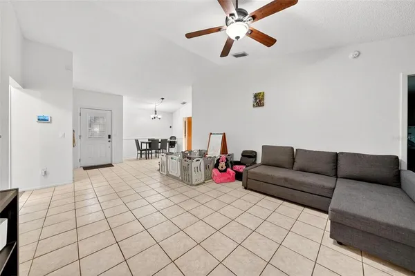 a dining room with furniture and window
