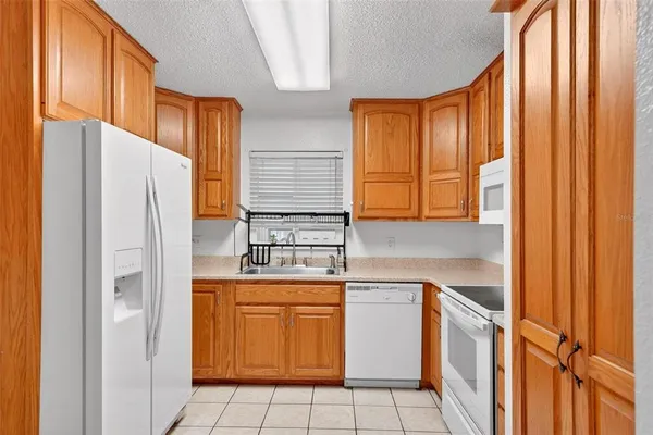 a kitchen with stainless steel appliances granite countertop a sink and a cabinets