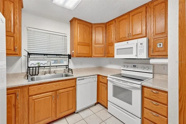 a kitchen with cabinets and appliances
