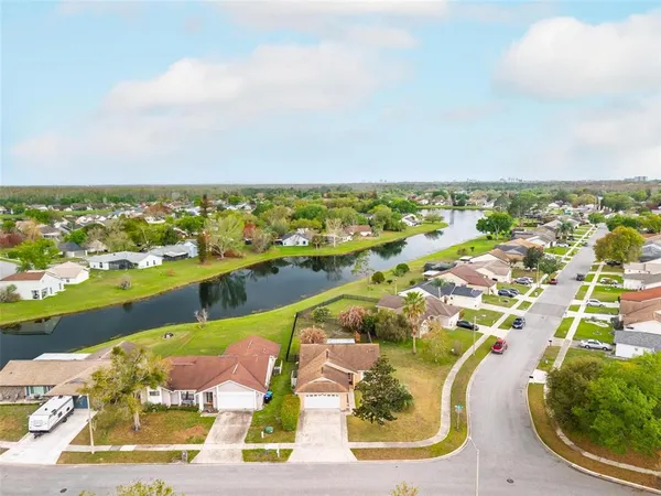 an aerial view of residential houses with outdoor space