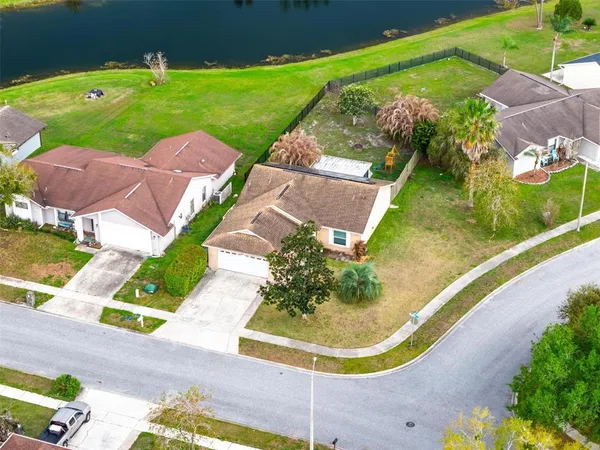 an aerial view of multiple houses with yard