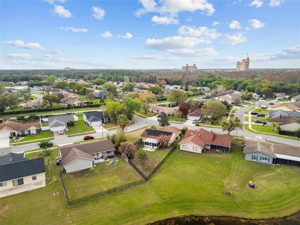 a view of a park with large trees