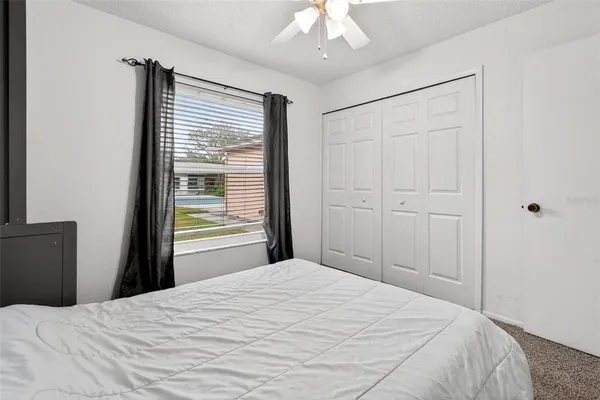 a living room with furniture a baby crib and a couch