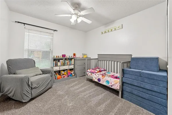 a bedroom with furniture and a dresser