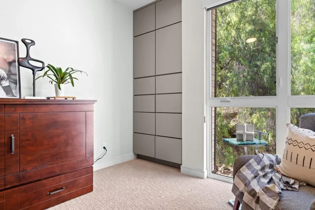 a view of a workspace with furniture and bedroom
