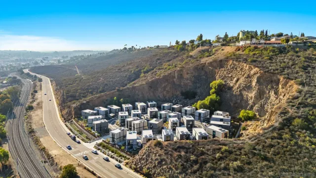 a view of multiple houses with yard