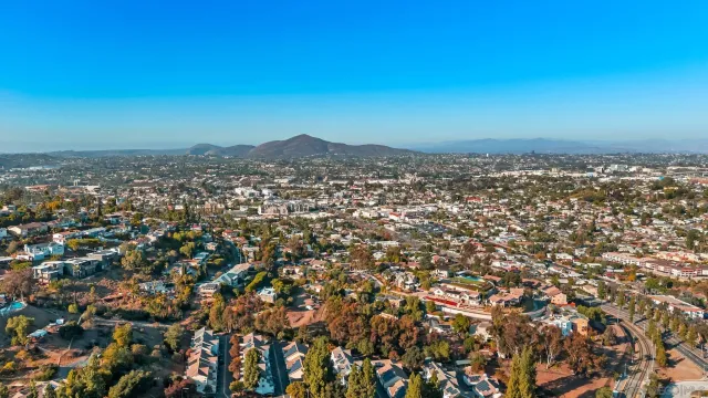 a view of a house with pool and deck