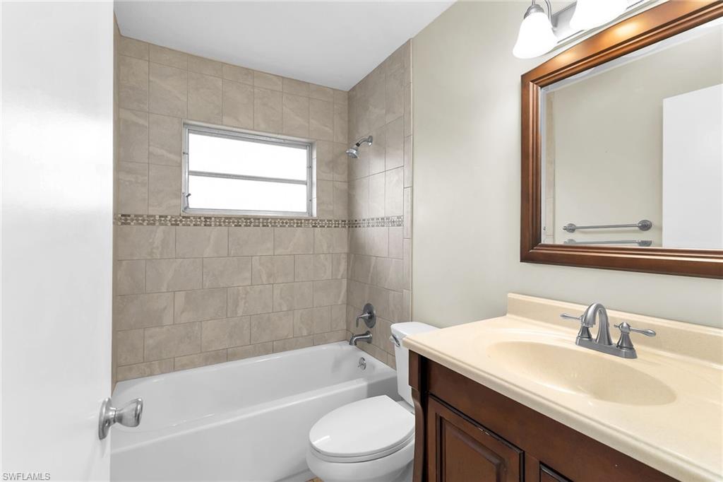 4502 22nd Place Southwest Naples, FL 34116 - Photo 17 of 30 Bathroom featuring vanity and tub / shower combination