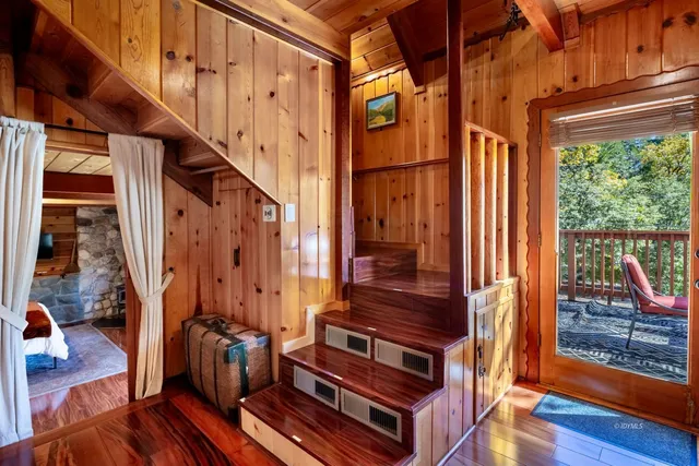 a view of balcony with wooden floor and furniture