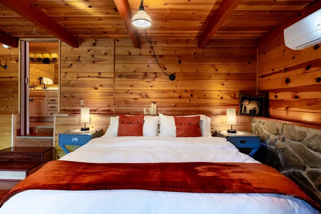 a bedroom with a bed and a table