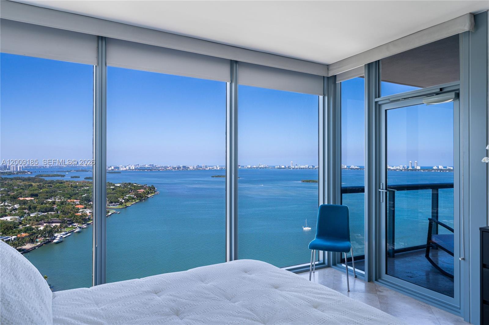601 Northeast 36th Street, Unit 2908 Miami, FL 33137 - Photo 12 of 19 a bedroom with a bed and a desk