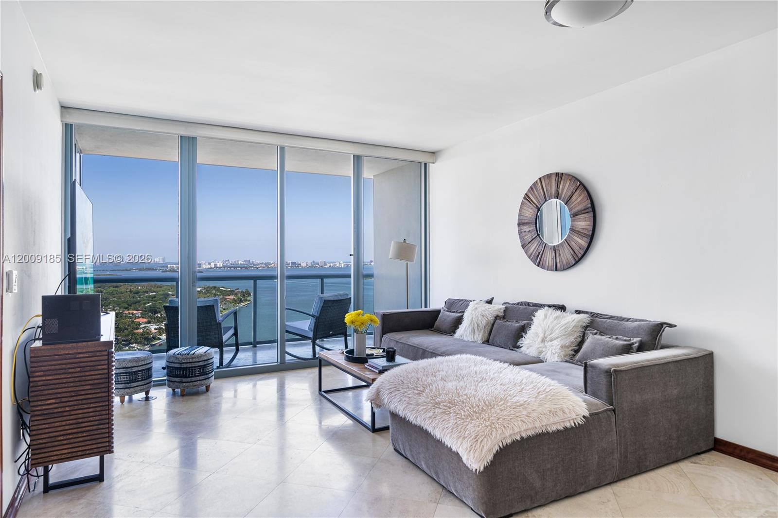 601 Northeast 36th Street, Unit 2908 Miami, FL 33137 - Photo 2 of 19 a living room with furniture and floor to ceiling window