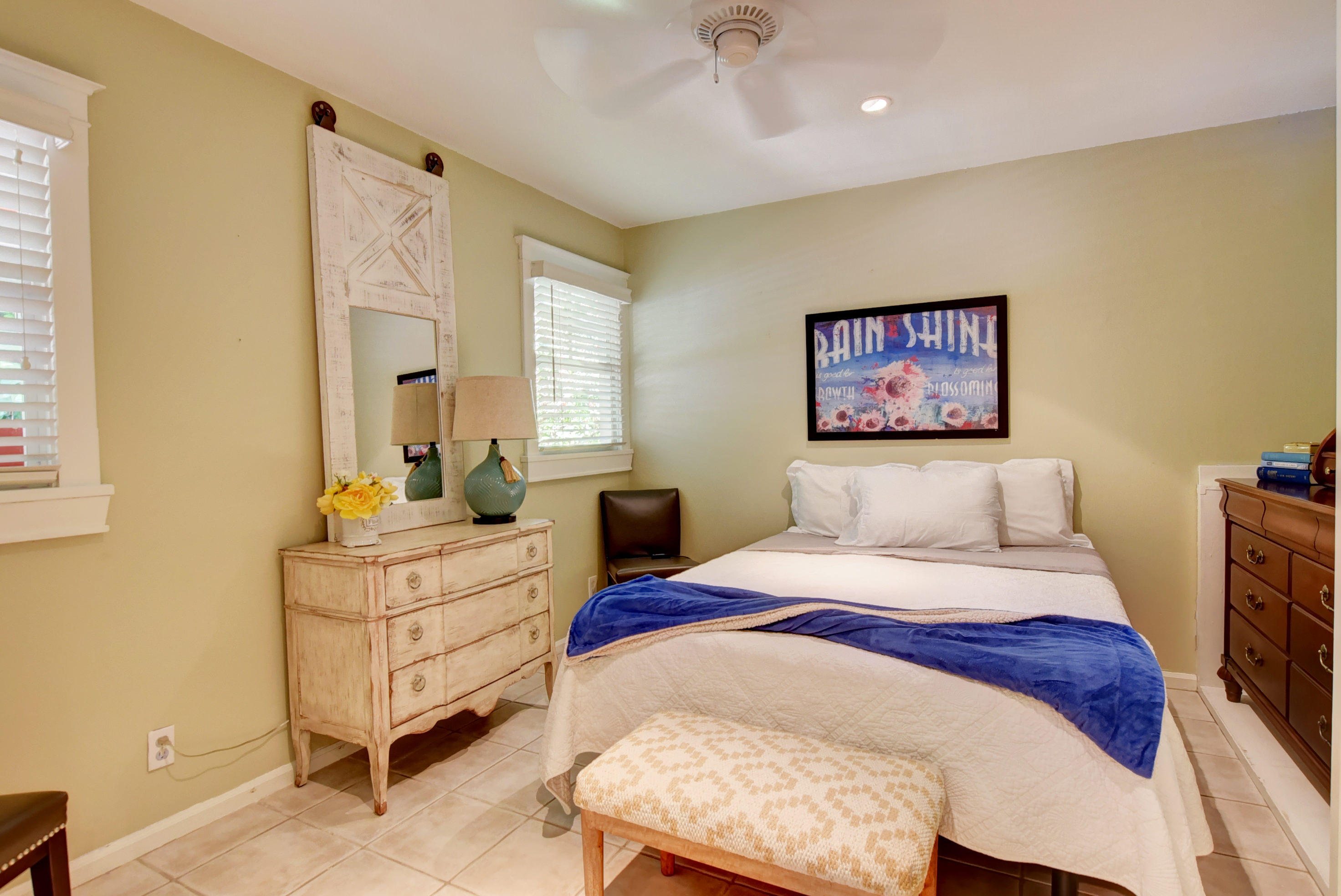 375 East Boca Raton Road Boca Raton, FL 33432 - Photo 29 of 43 a spacious bedroom with a bed a couch and a window