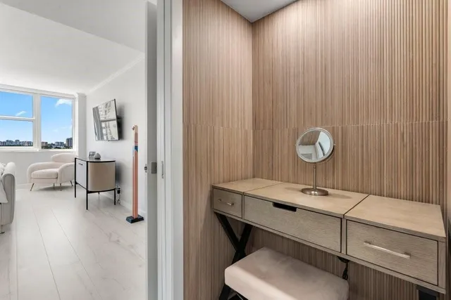 a hallway with a table and chairs