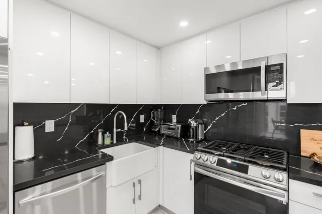 a kitchen with a stove and a microwave