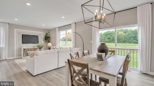 a view of a dining room with furniture window and outside view