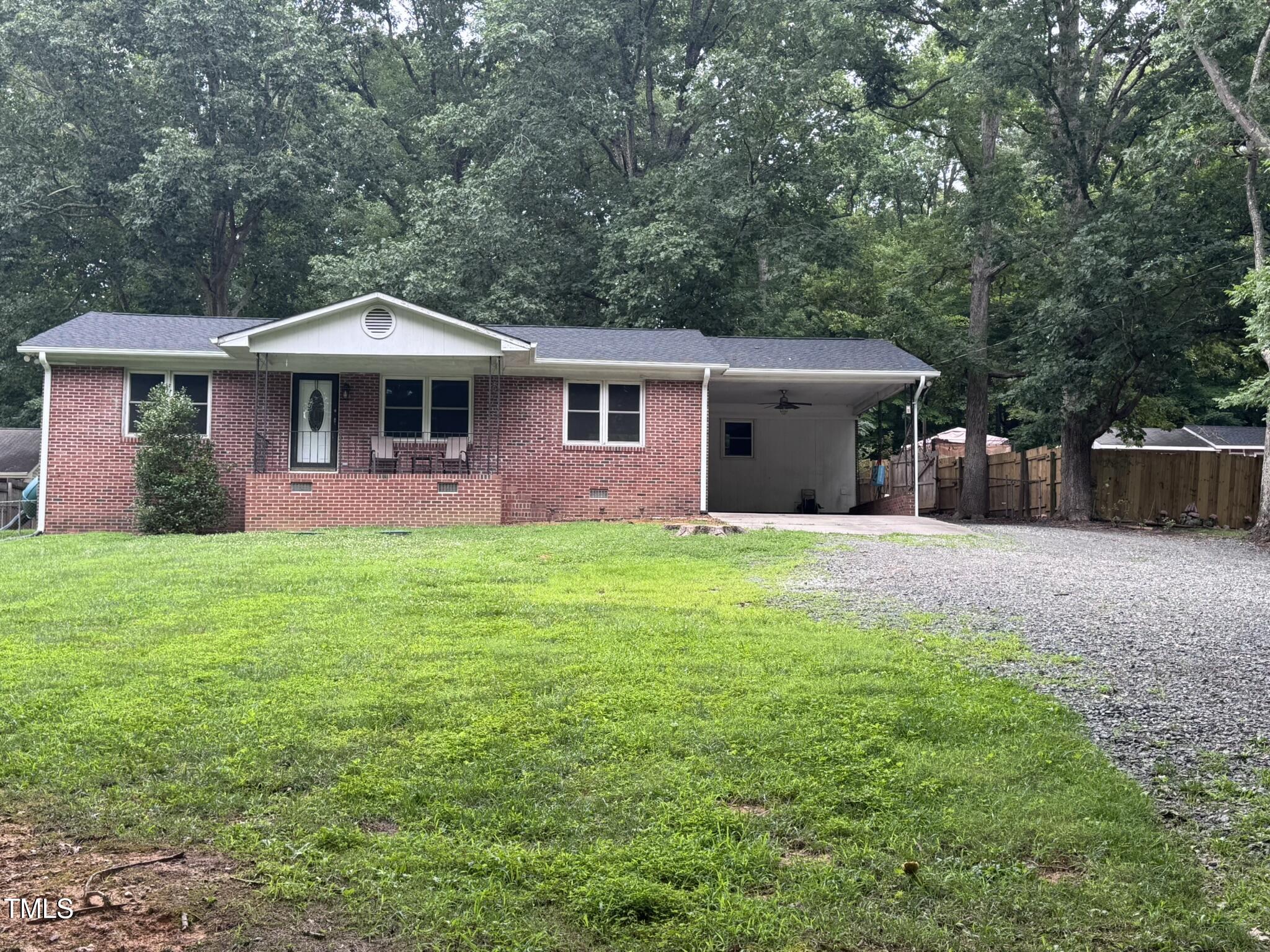6740 Guess Road Hillsborough, NC 27278 - Photo 1 of 17 a front view of a house with yard and green space