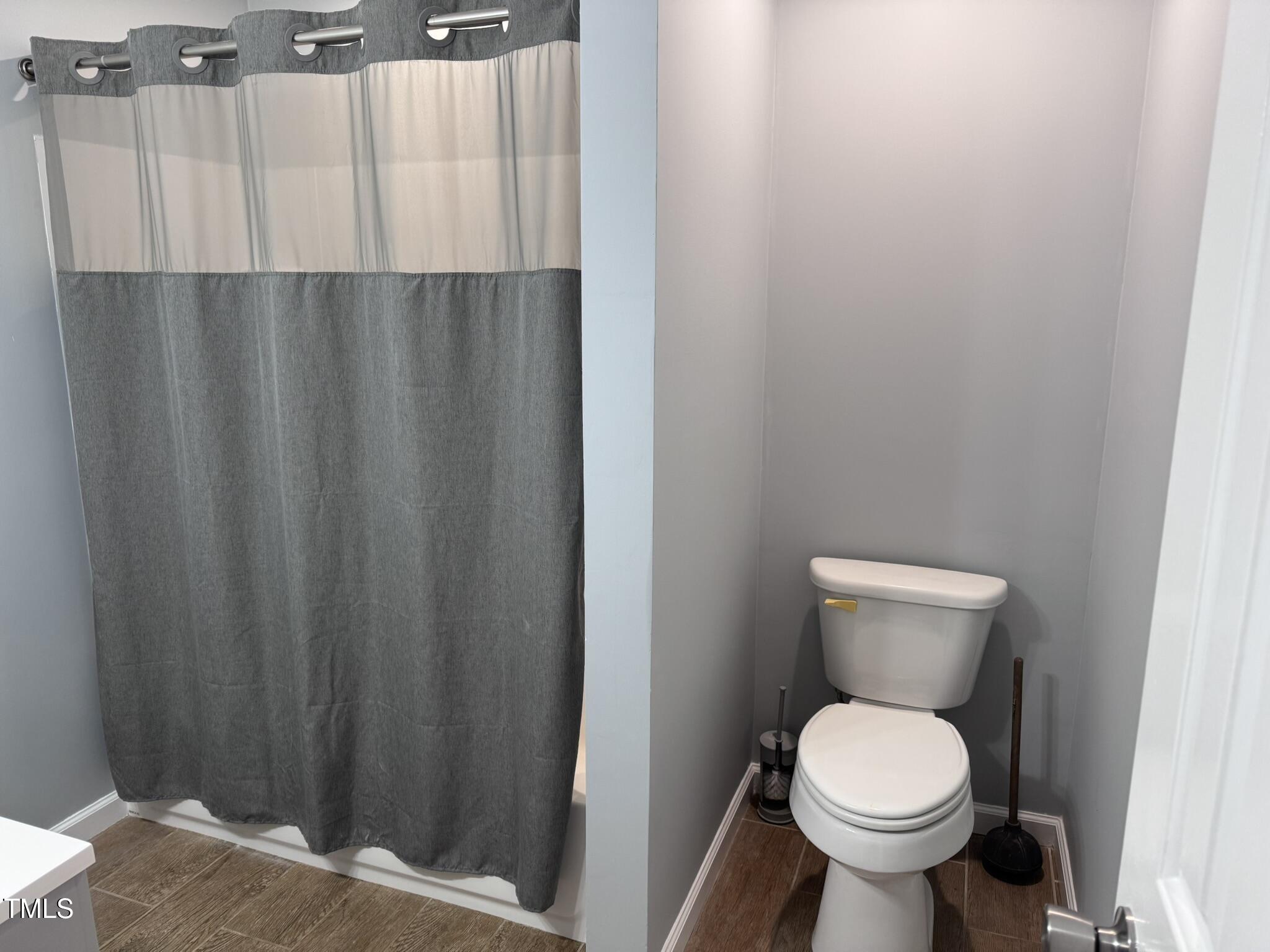 6740 Guess Road Hillsborough, NC 27278 - Photo 12 of 17 a bathroom with a toilet and a sink