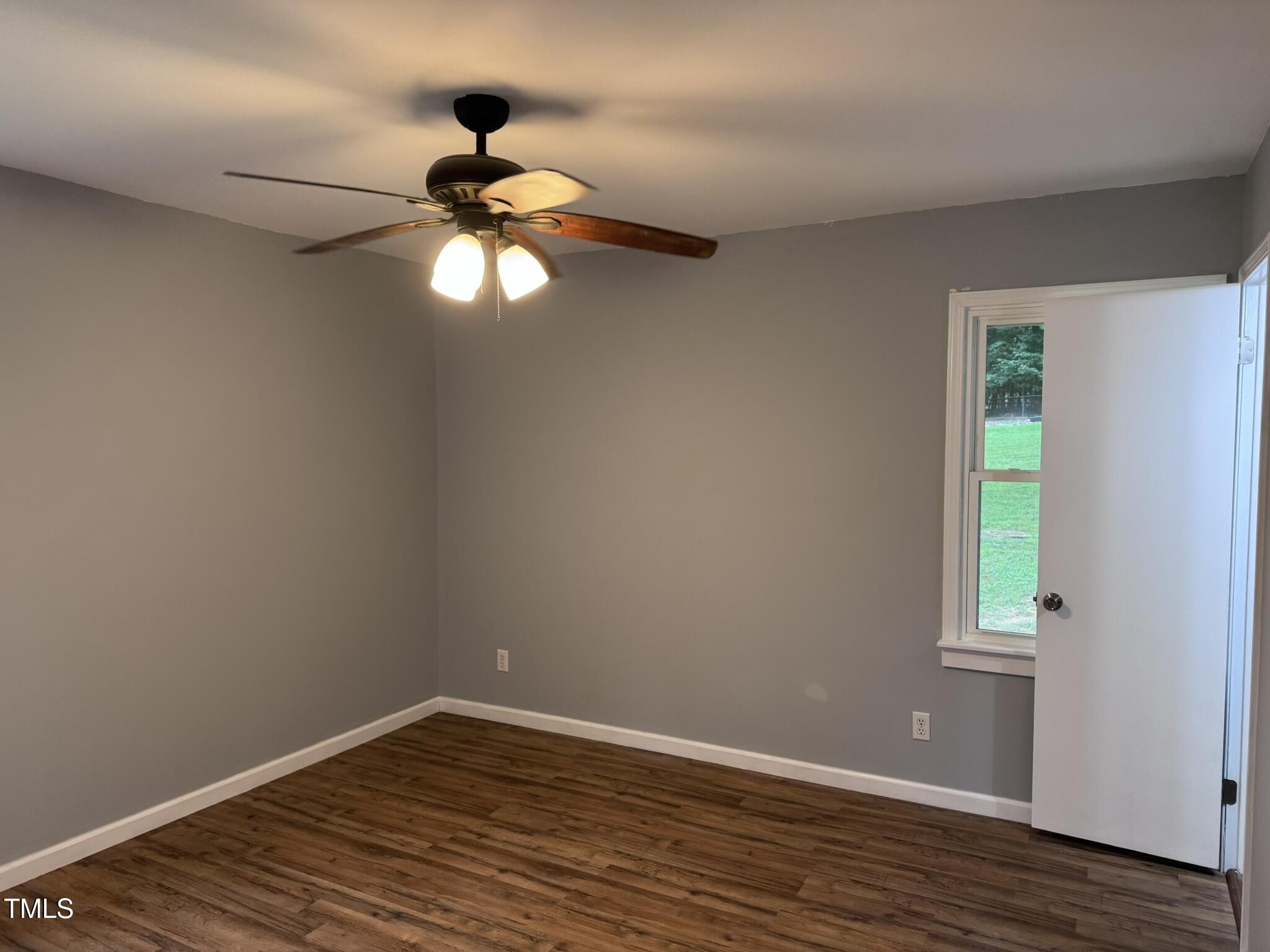 6740 Guess Road Hillsborough, NC 27278 - Photo 13 of 17 a view of a chandelier fan and window in a room