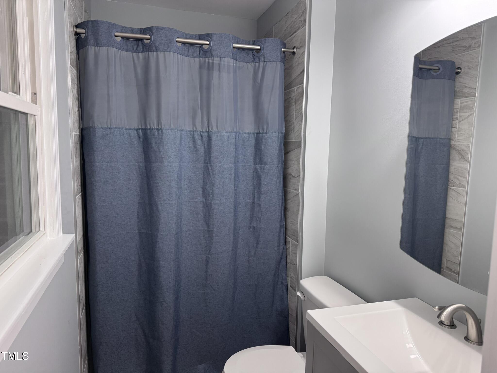 6740 Guess Road Hillsborough, NC 27278 - Photo 14 of 17 a bathroom with a sink and a toilet