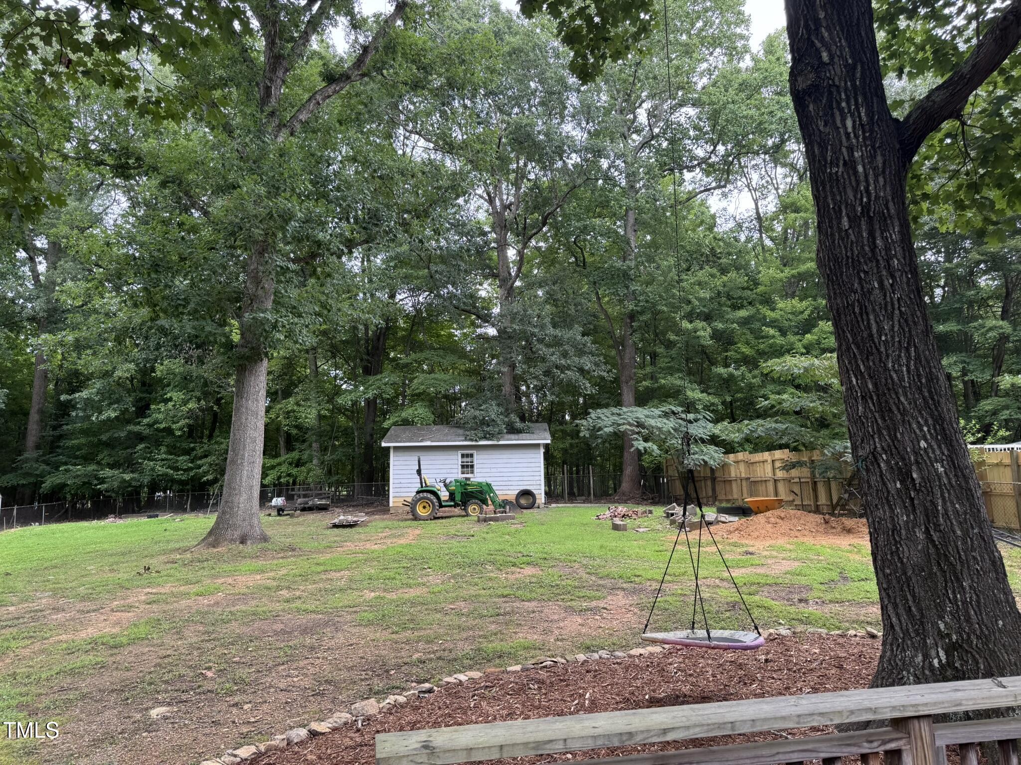 6740 Guess Road Hillsborough, NC 27278 - Photo 17 of 17 a view of a house with a yard