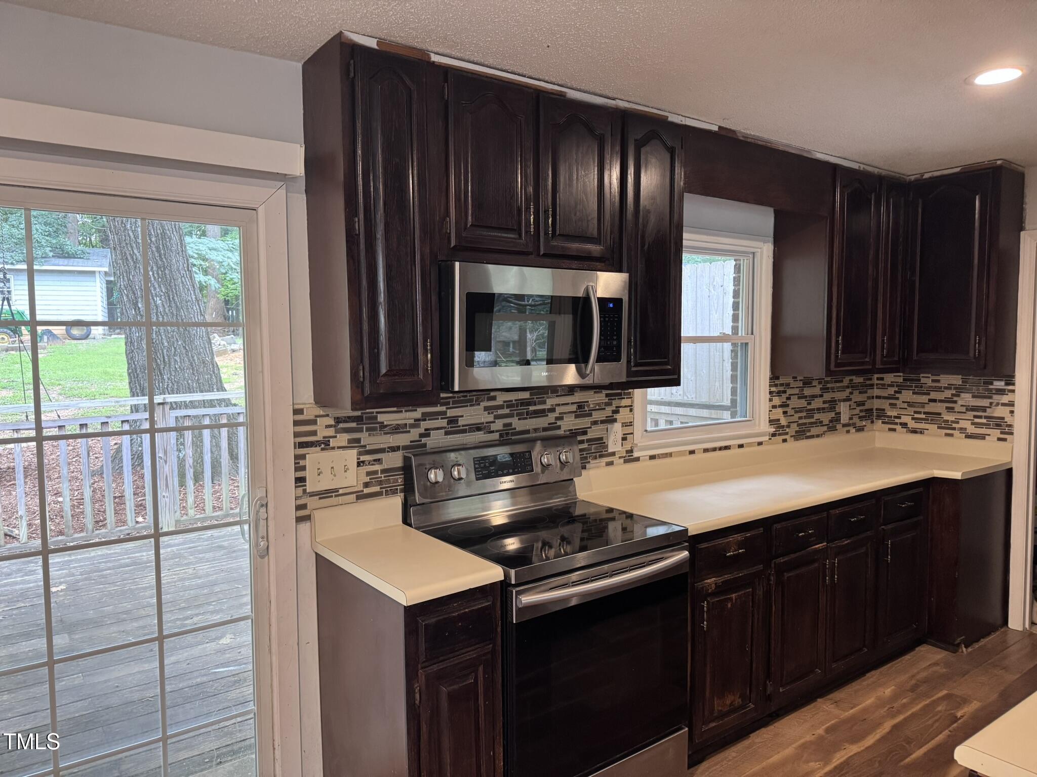 6740 Guess Road Hillsborough, NC 27278 - Photo 8 of 17 a kitchen with a sink and a stove top oven