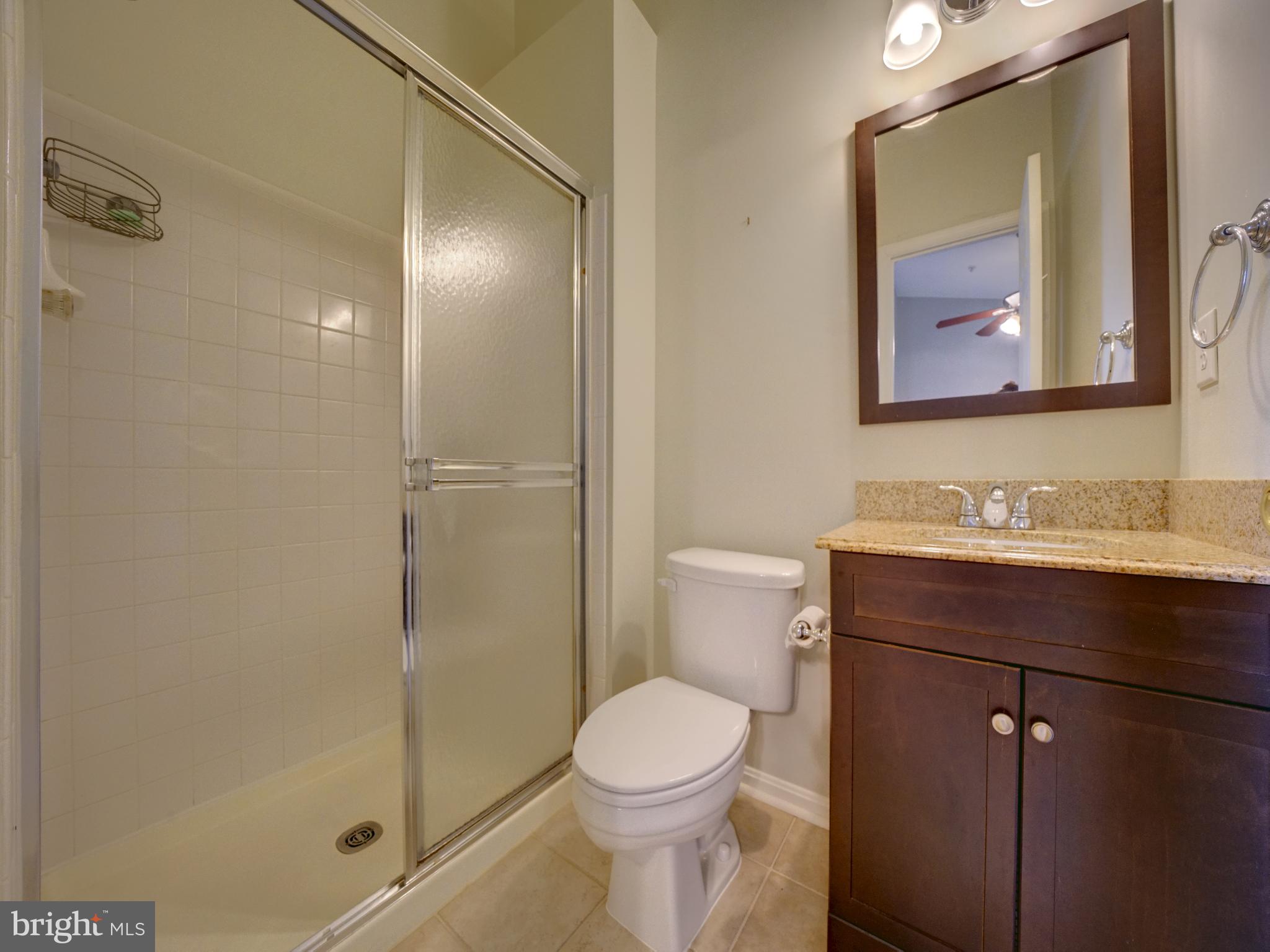 2238 Commissary Circle Odenton, MD 21113 - Photo 27 of 48 a bathroom with a toilet a sink and mirror