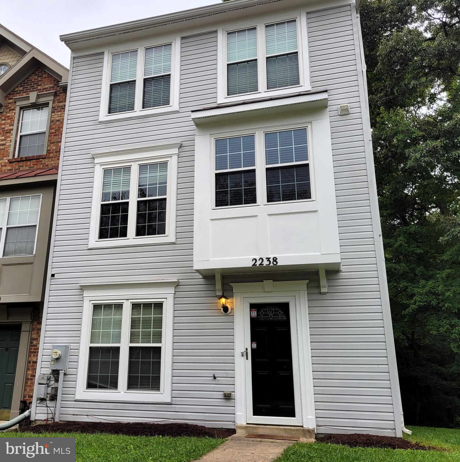 2238 Commissary Circle Odenton, MD 21113 - Photo 40 of 48 a view of a building with a window and large tree