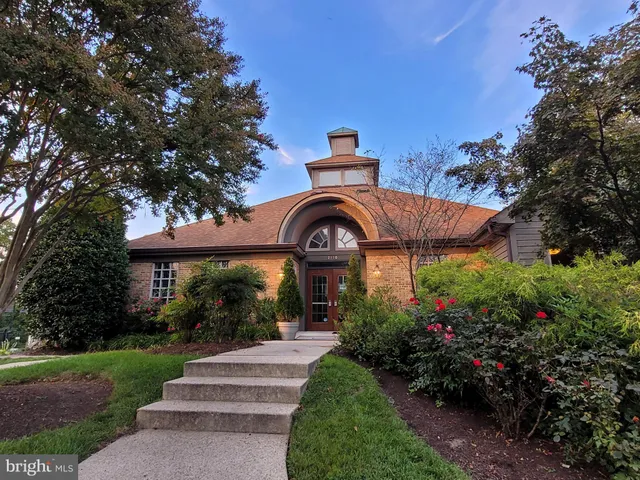 a view of a balcony with wooden floor and fence