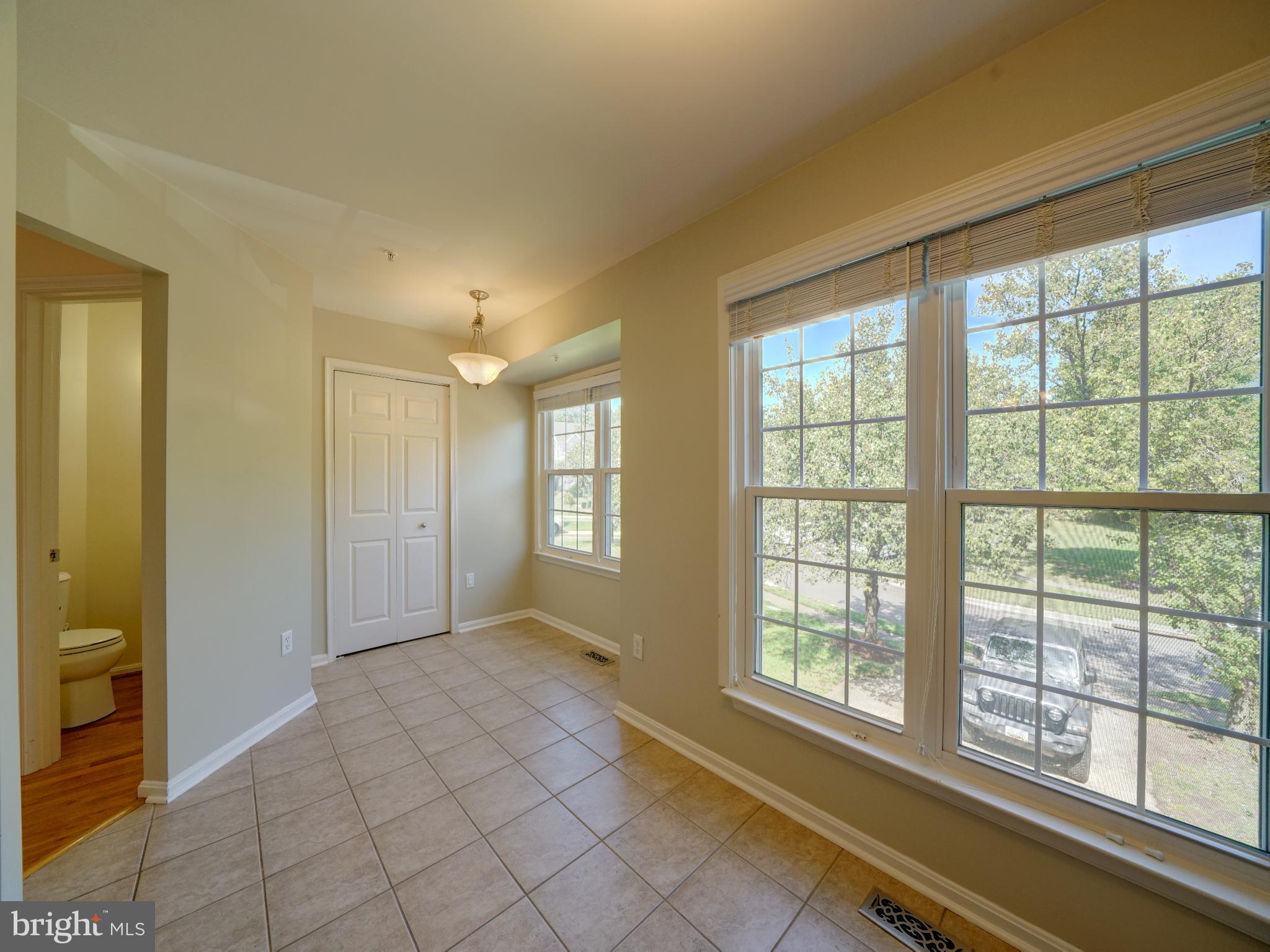 2238 Commissary Circle Odenton, MD 21113 - Photo 10 of 48 a view of an empty room with glass door and a window