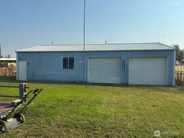 a white toilet sitting next to a shower curtain
