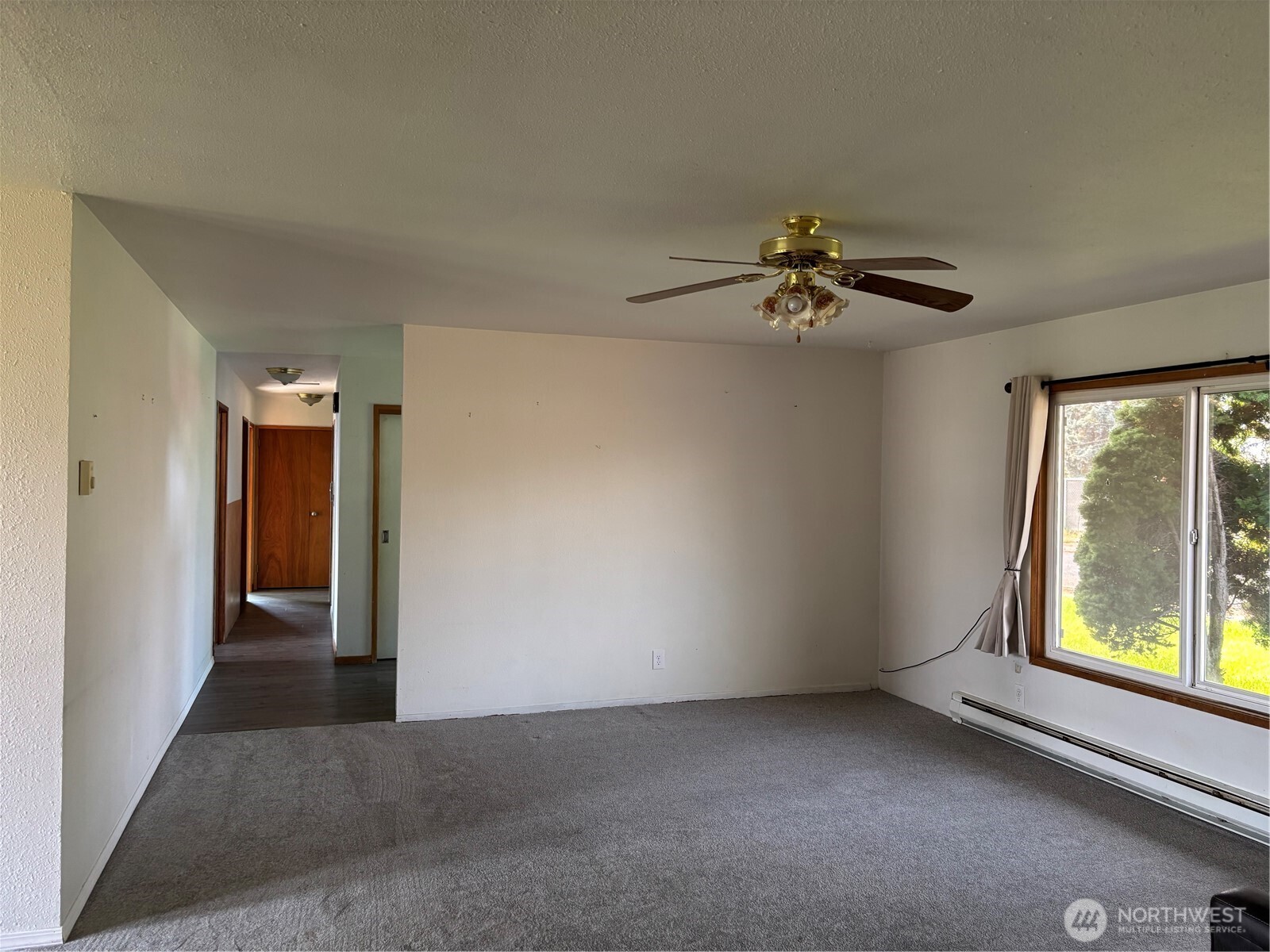 9008 Bong Loop, Unit B Moses Lake, WA 98837 - Photo 14 of 27 a view of an empty room with a window
