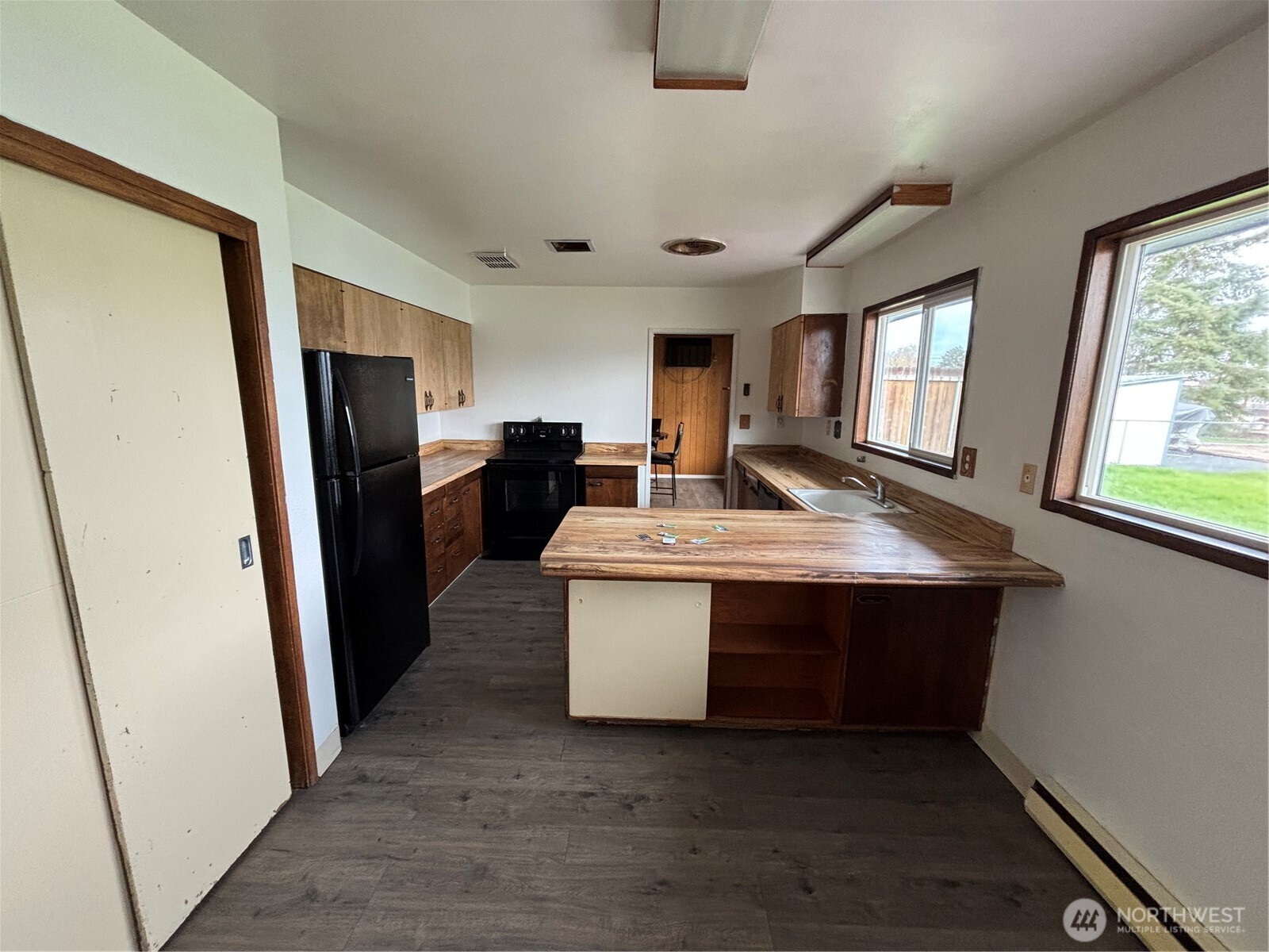 9008 Bong Loop, Unit B Moses Lake, WA 98837 - Photo 15 of 27 a kitchen with stainless steel appliances a sink stove and refrigerator
