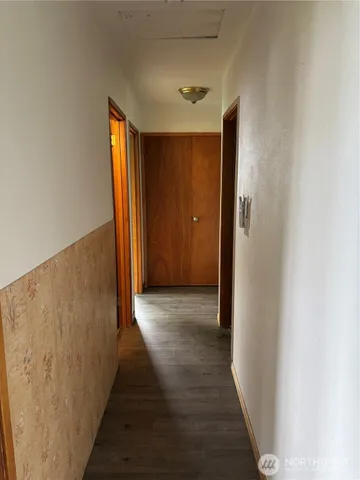 a view of a livingroom with a fireplace and a window